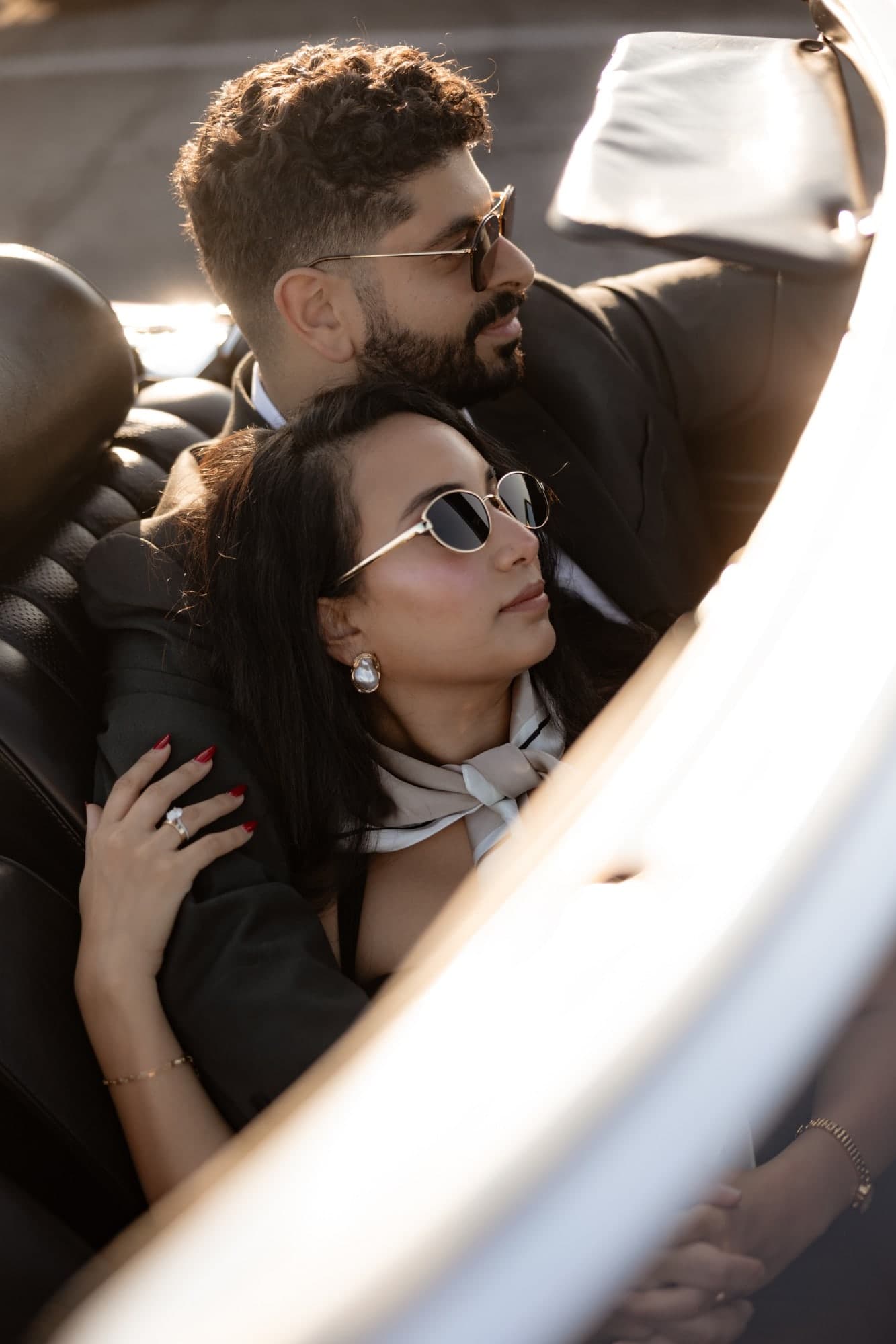 The engagement ring, close up in the convertible